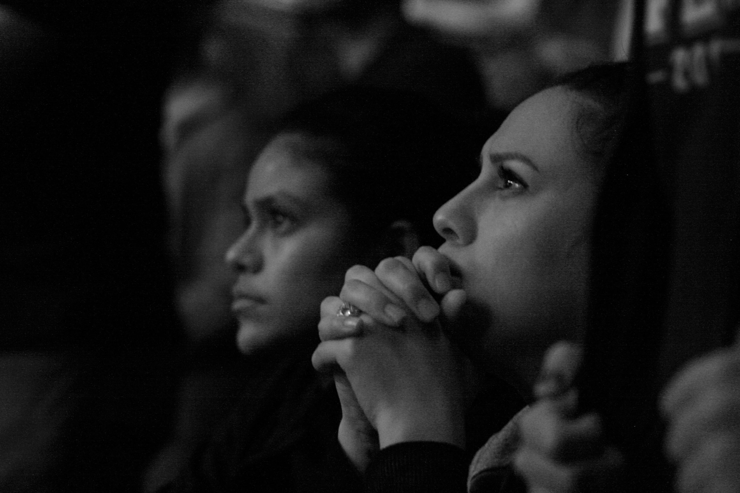 An audience member listening to a speech