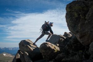 A man climbing on rocks